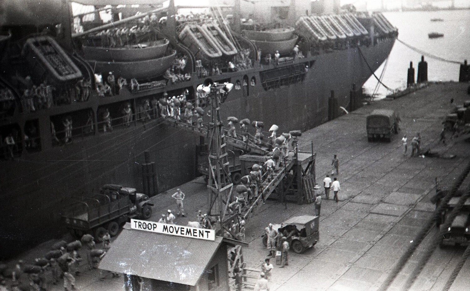Soldiers Boarding Troopship via Gangway at "Troop Movement" Station, Philippines, World War II
