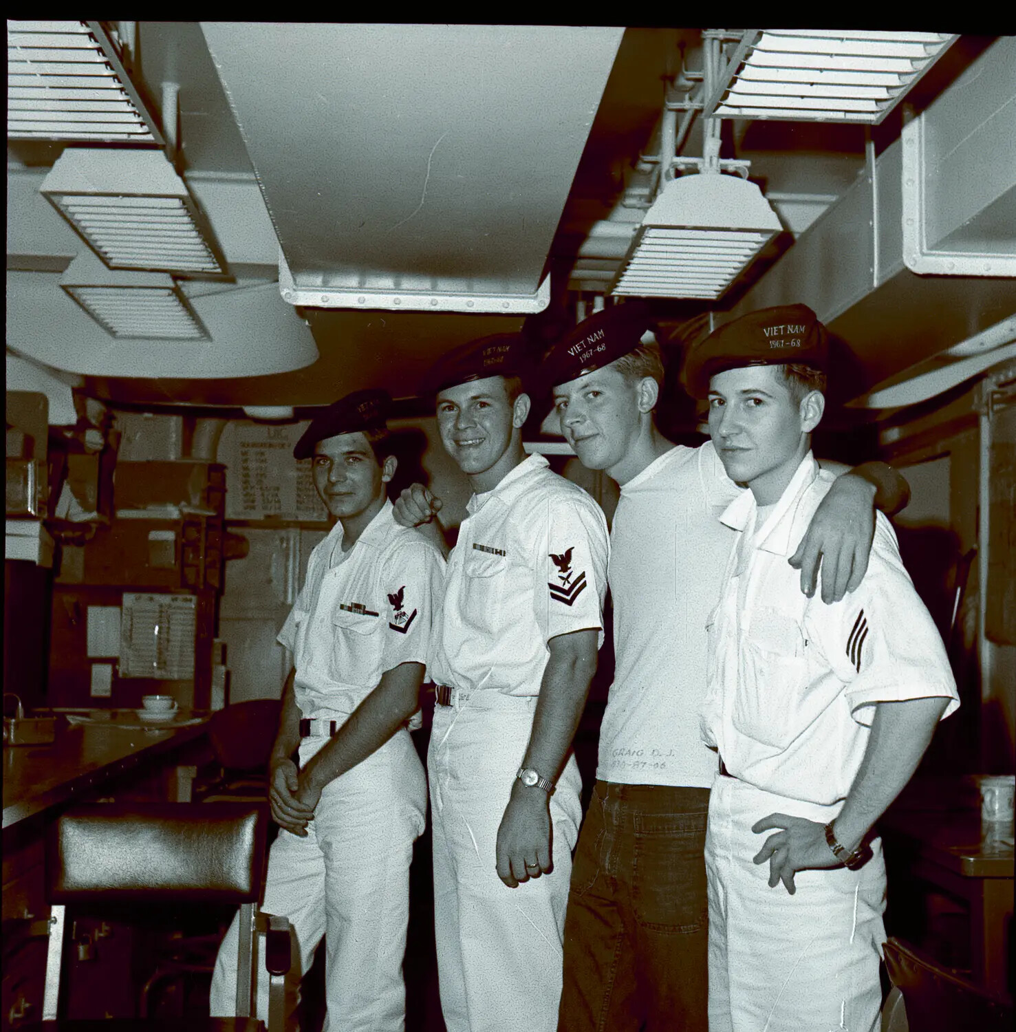 Four U.S. Navy Sailors with 'VIET NAM 1967-68' Caps Aboard USS Ticonderoga
