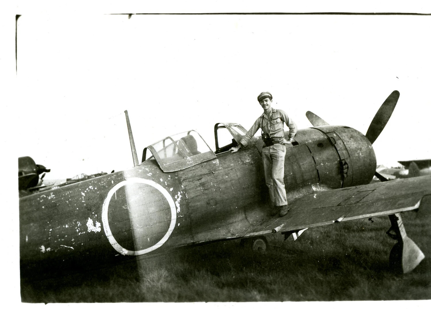 American Serviceman Posing with Captured Japanese Fighter Aircraft, CBI Theater, WWII
