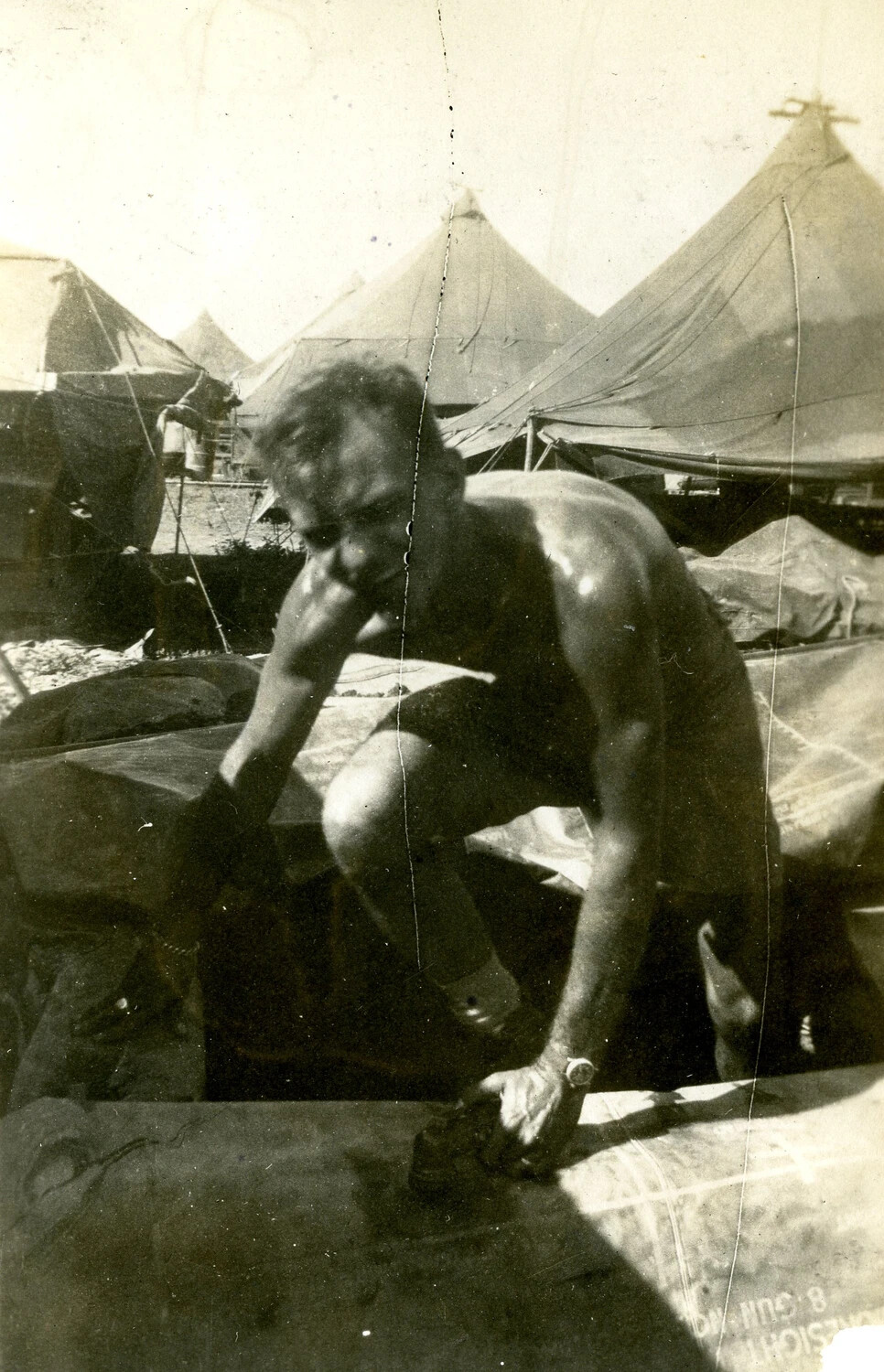Serviceman Atop Stenciled Supply Crate, 345th Bombardment Group Encampment, Pacific Theater, WWII