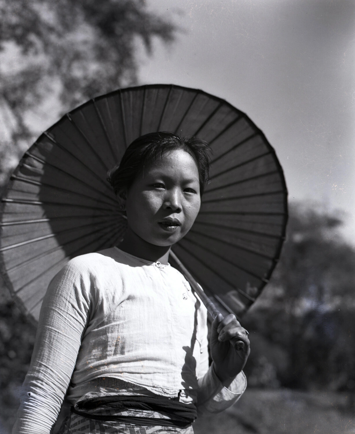 Portrait of a Young Burmese Woman with Traditional Parasol, China-Burma-India Theater, WWII
