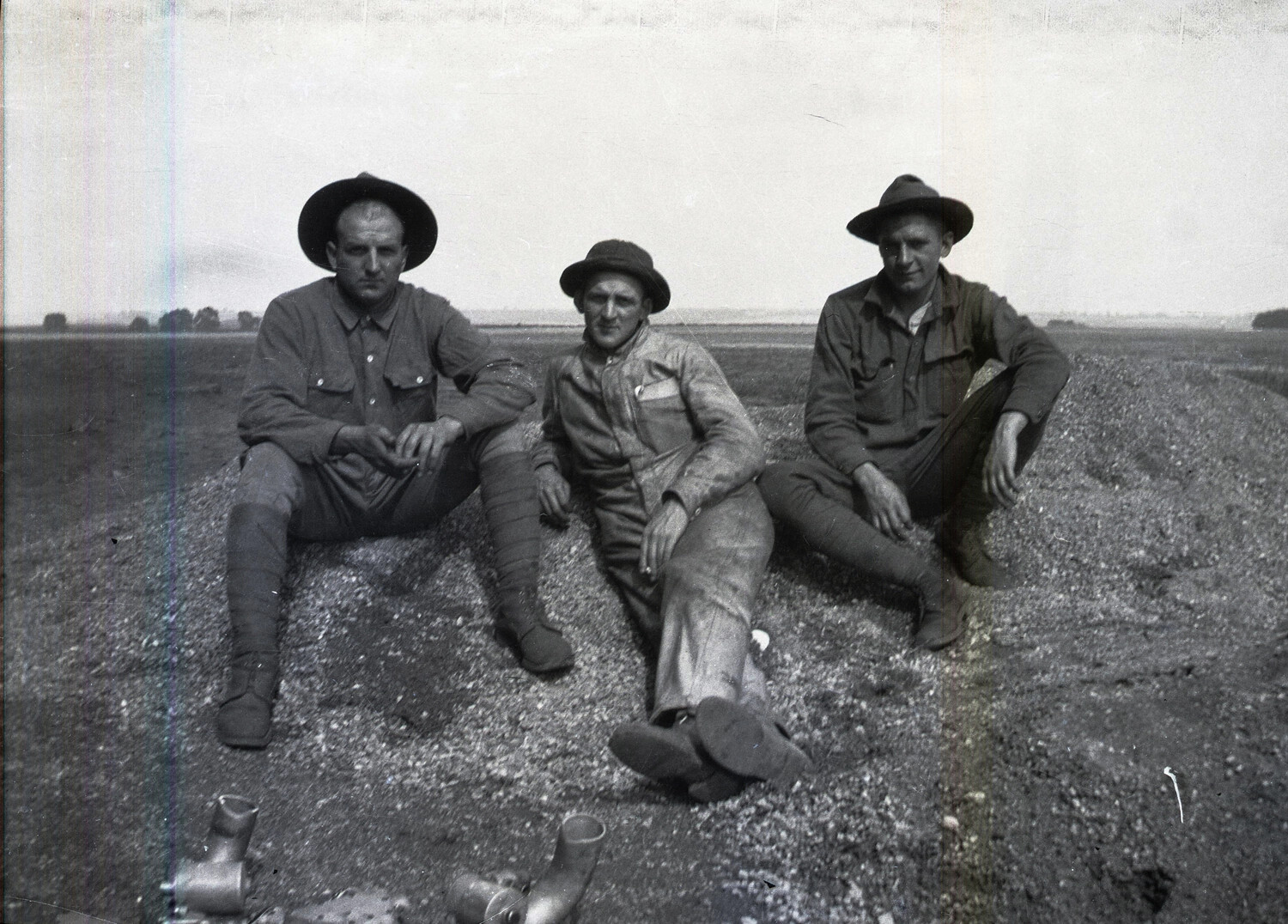 Three American Servicemen Seated in a Field, World War I, France