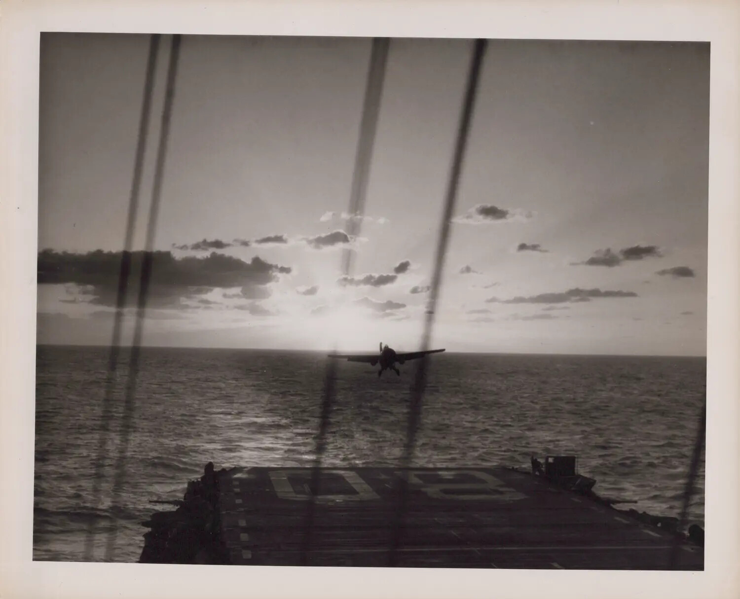 Fighter Aircraft Launching from Escort Carrier at Sunset, WWII