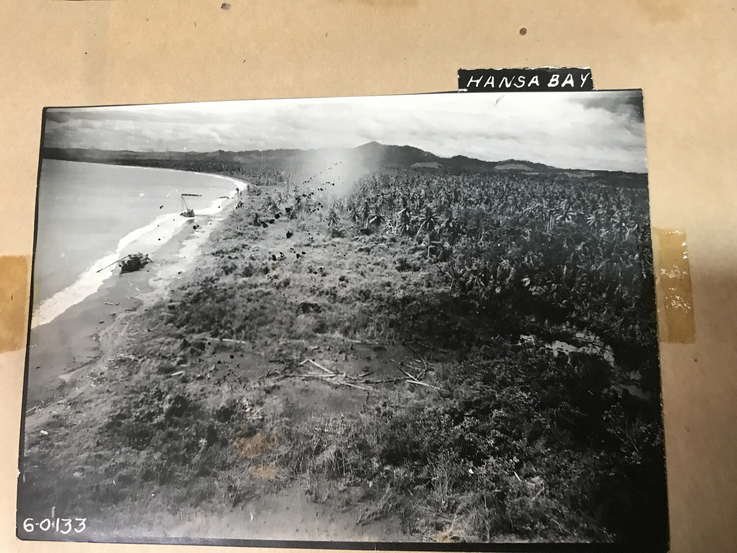 Album Page: Aerial Photograph of Hansa Bay Shoreline with Original Label and Frame Number