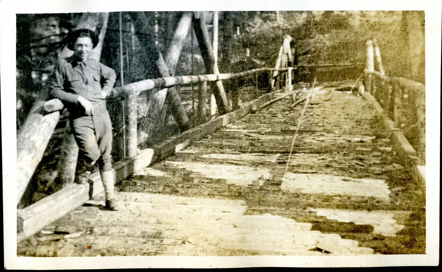 American Soldier on Log Footbridge, WWI Photo Album, c. 1917-1918