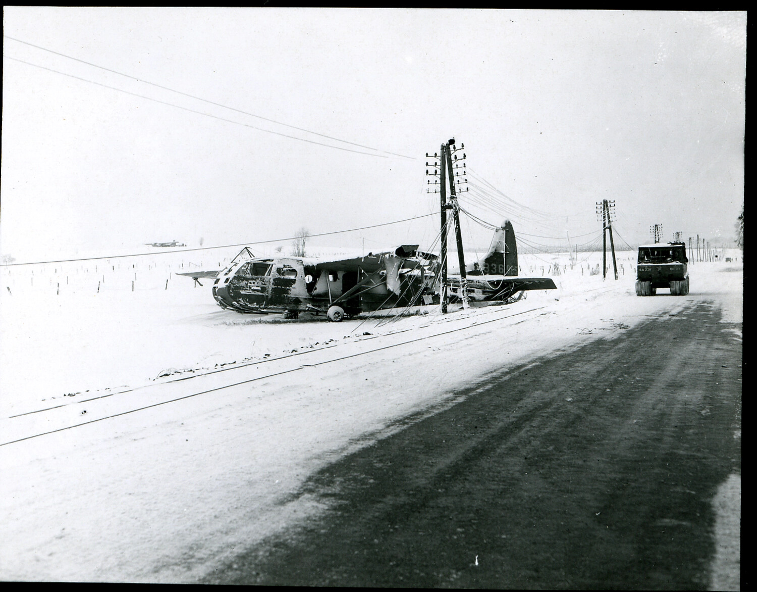 Wrecked Waco CG-4A Glider Entangled in Downed Power Lines, Bastogne, Belgium, Winter 1944-45