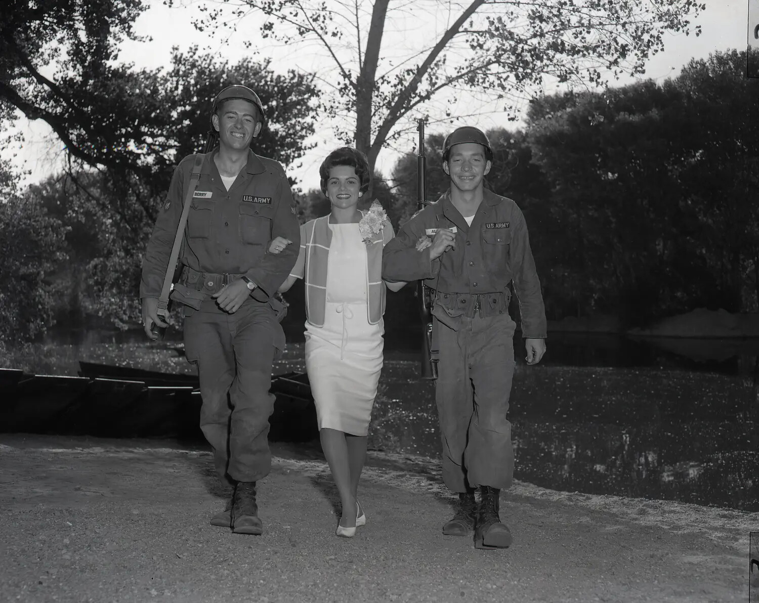 Civilian Sponsor Escorted by Two Guardsmen Along Riverbank, National Guard Summer Camp, July 1960