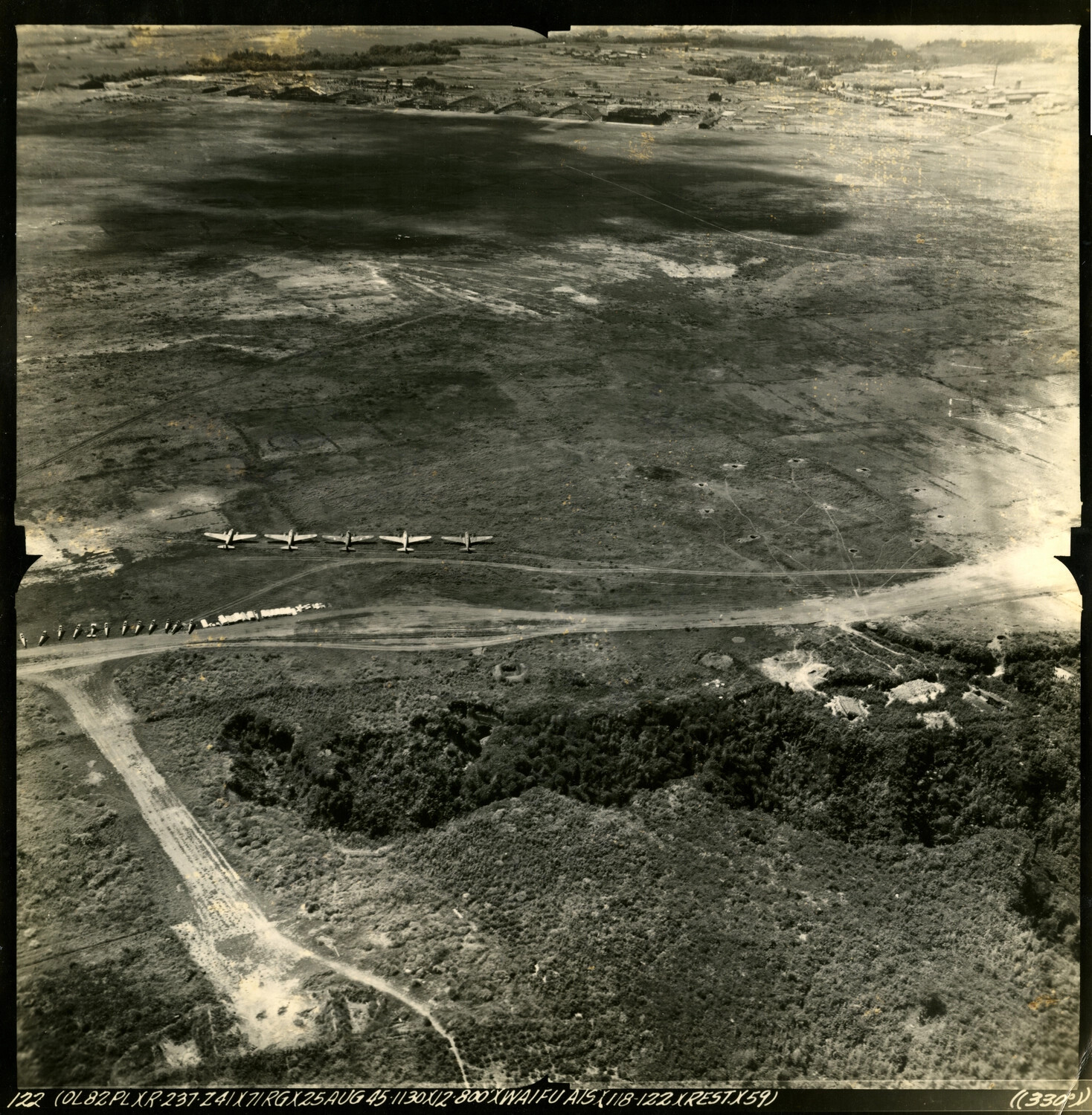 Aerial Reconnaissance Photograph of Waifu Airstrip with Parked Aircraft, 25 August 1945