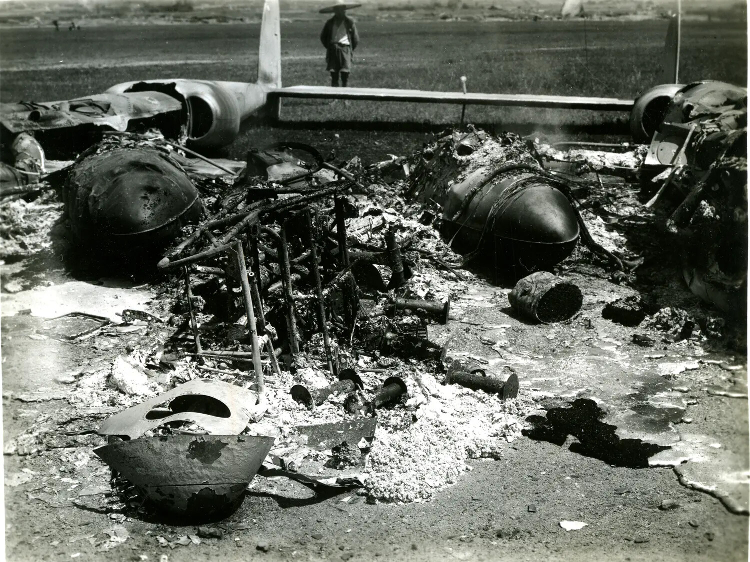 Burned Wreckage of Twin-Engine Aircraft, China-Burma-India Theater, WWII