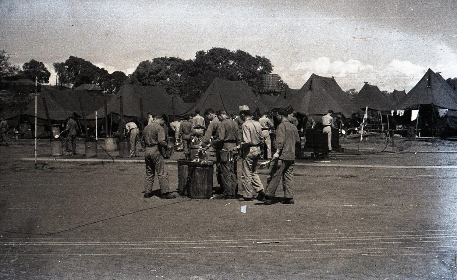Soldiers Washing Mess Kits at a U.S. Army Tent Camp, Luzon, Philippines, WWII