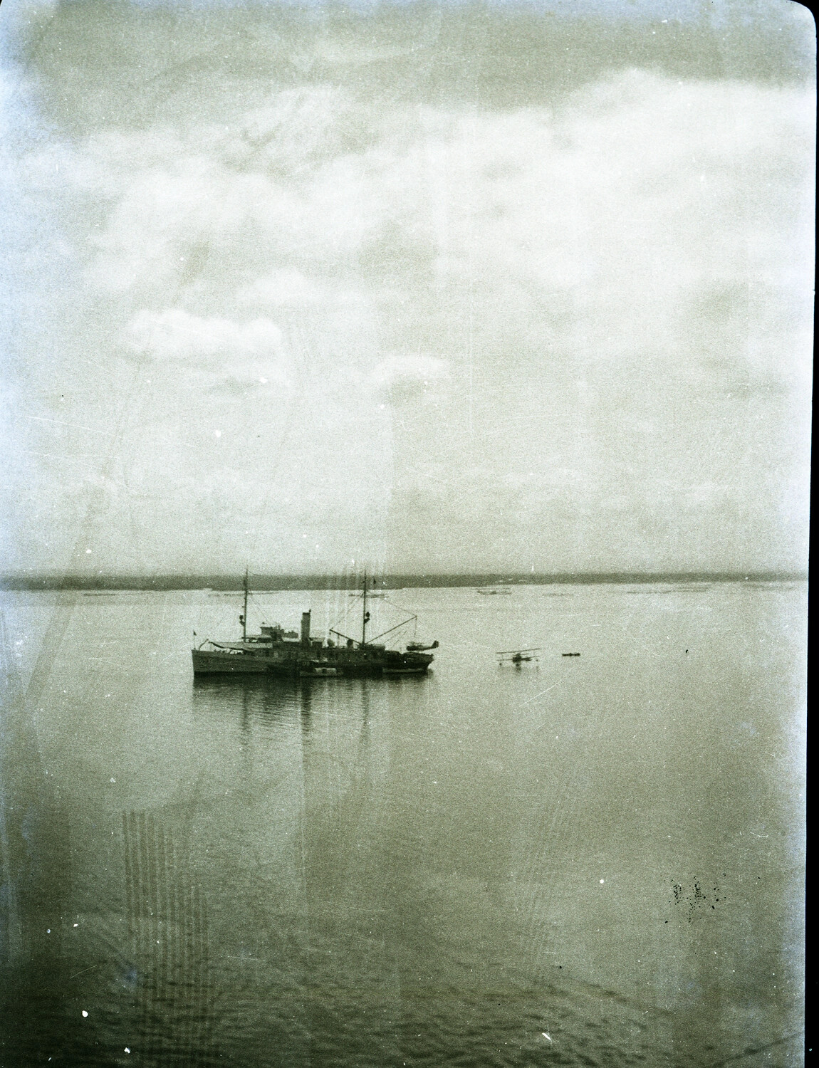 U.S. Navy Gunboat and Seaplane at Anchor, China Station, c. 1930s