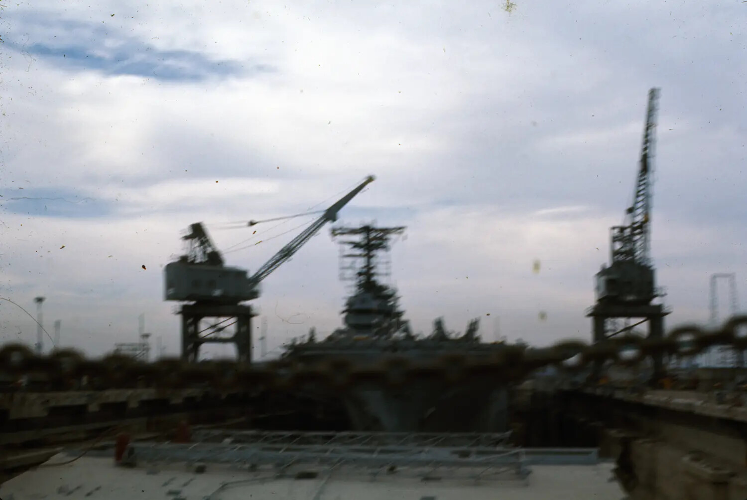 Aircraft Carrier in Dry Dock at Naval Shipyard, Silhouette View