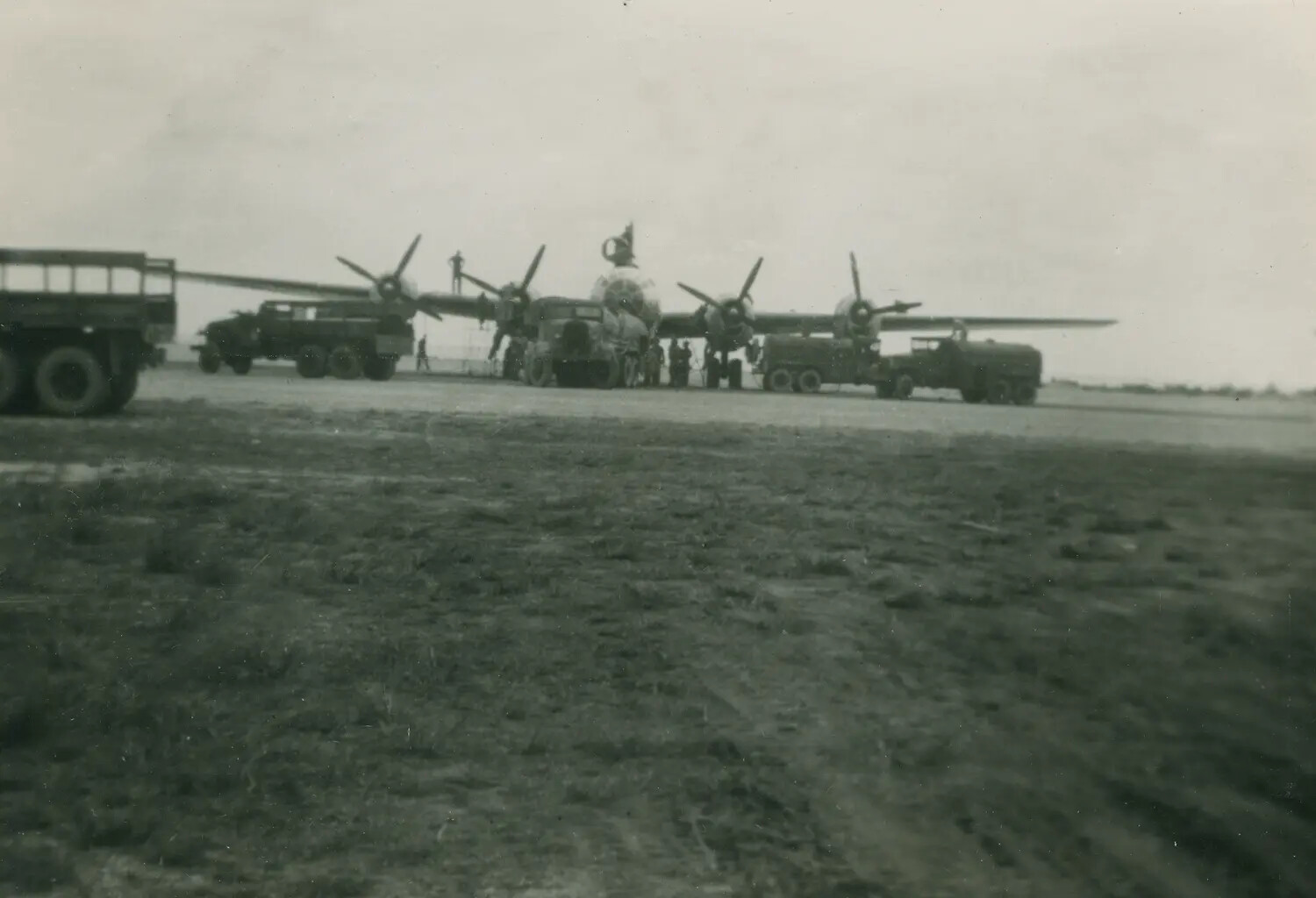 Fairchild C-119 Flying Boxcar Undergoing Ground Servicing on an Airfield Ramp