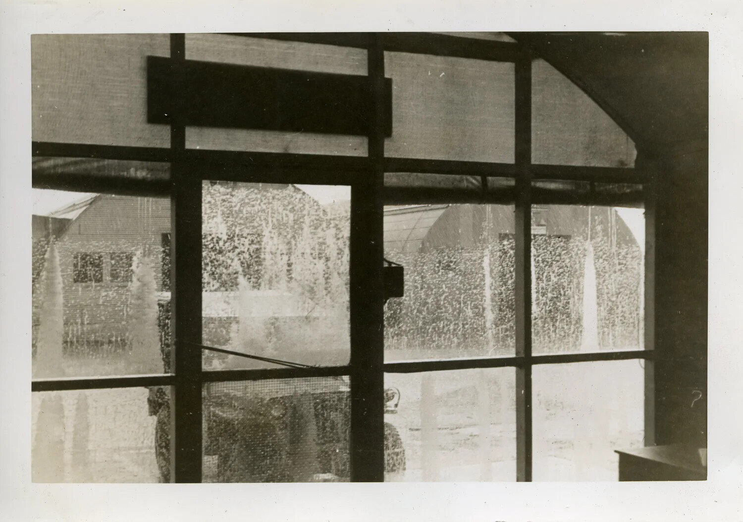 View Through Screened Window During Tropical Rainstorm, VR-6 Squadron Album, Guam/Pacific Base
