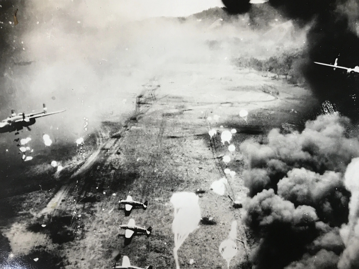 B-25 Mitchells Attacking Japanese Airfield Amid Smoke and Parafrag Bombs, Wewak Area, New Guinea