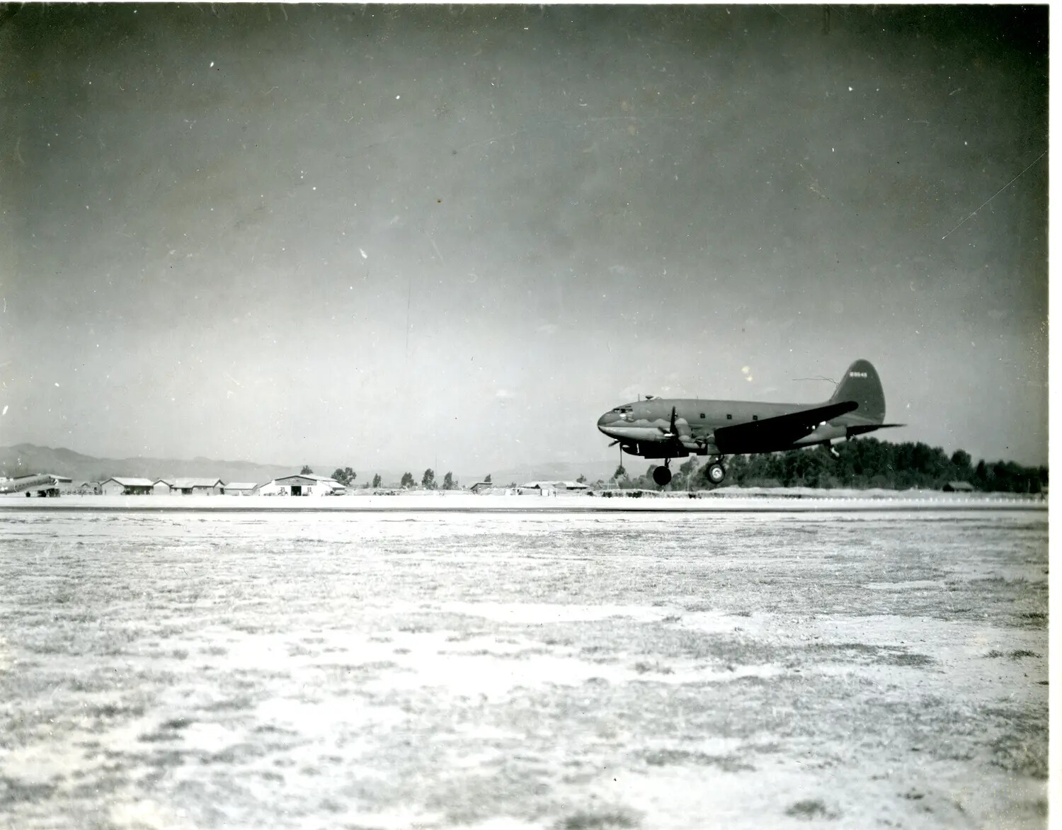 Curtiss C-46 Commando Transport Aircraft on Takeoff/Landing, CBI Theater Airfield, WWII