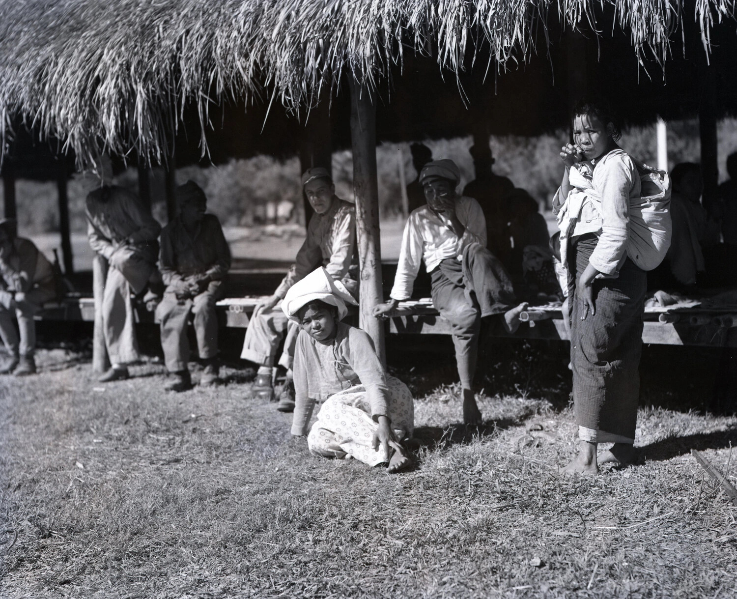 Burmese Villagers Resting Under Thatched Shelter, CBI Theater, WWII