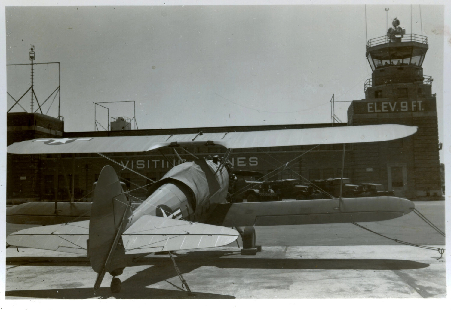 Boeing-Stearman N2S-3 Kaydet Trainer on Ramp, Naval Air Station, "Visiting Planes" Hangar