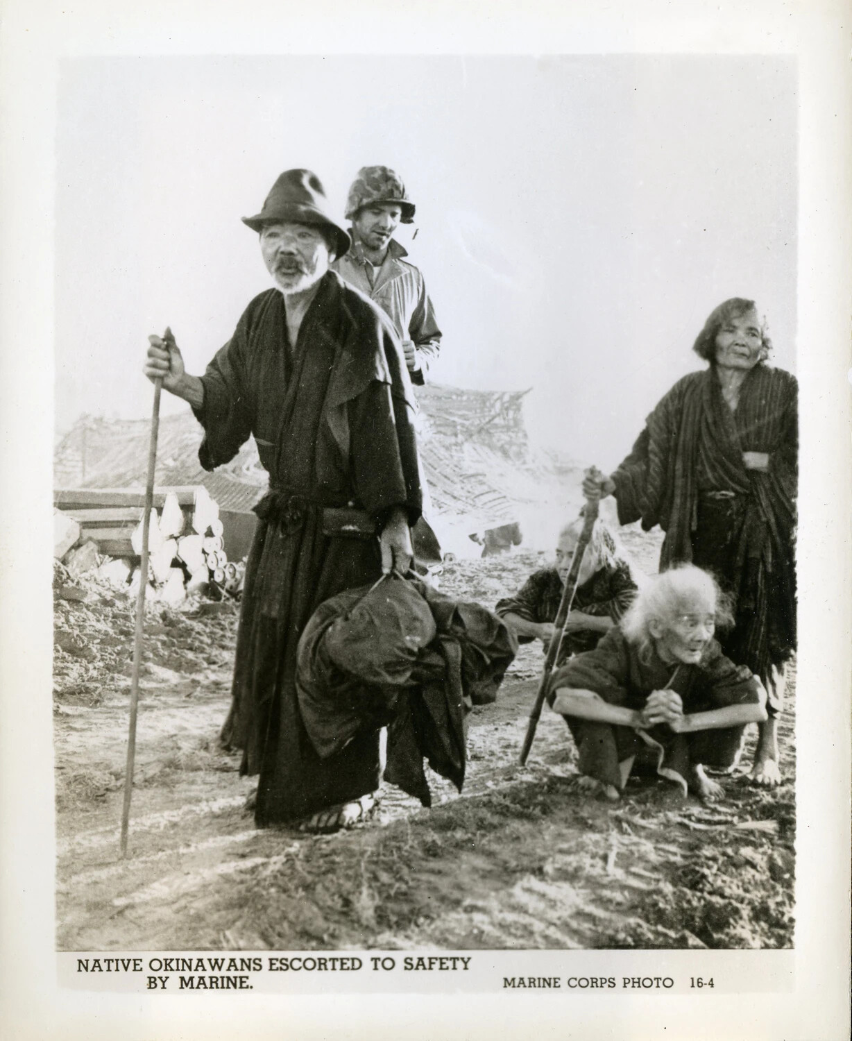 Native Okinawans Escorted to Safety by a U.S. Marine, Battle of Okinawa, 1945