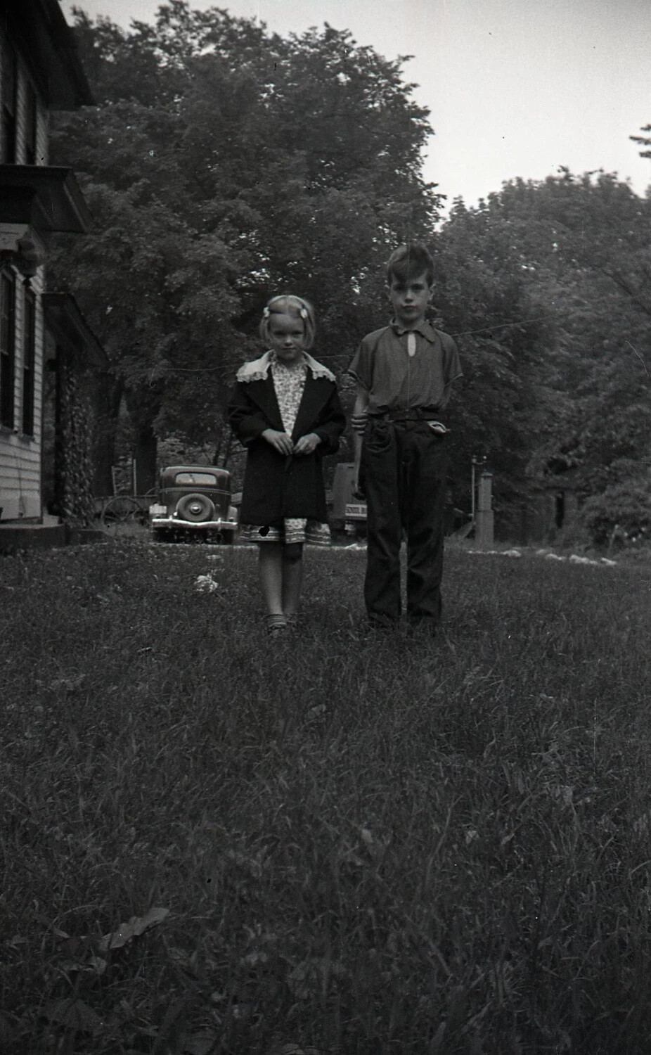 Two Children in Farmyard with Vintage Automobile, WWII-Era Home Front Snapshot