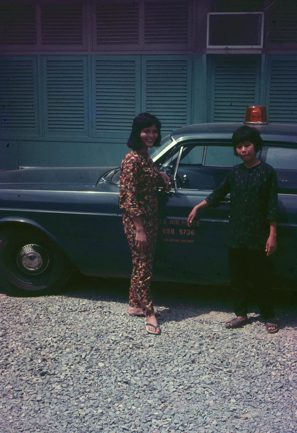 Vietnamese Women Beside a U.S. Air Force Staff Car, South Vietnam, 1965 (3rd Tactical Fighter Wing Collection)