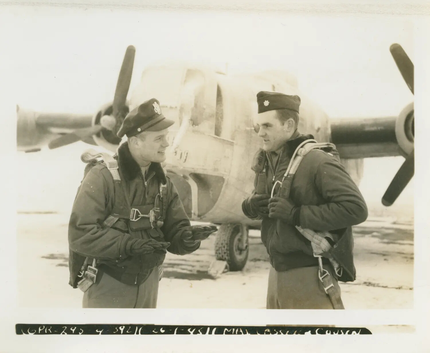 Officers in Flight Gear Beside B-24 Liberator Nose, Wendling Airfield, England, January 1945