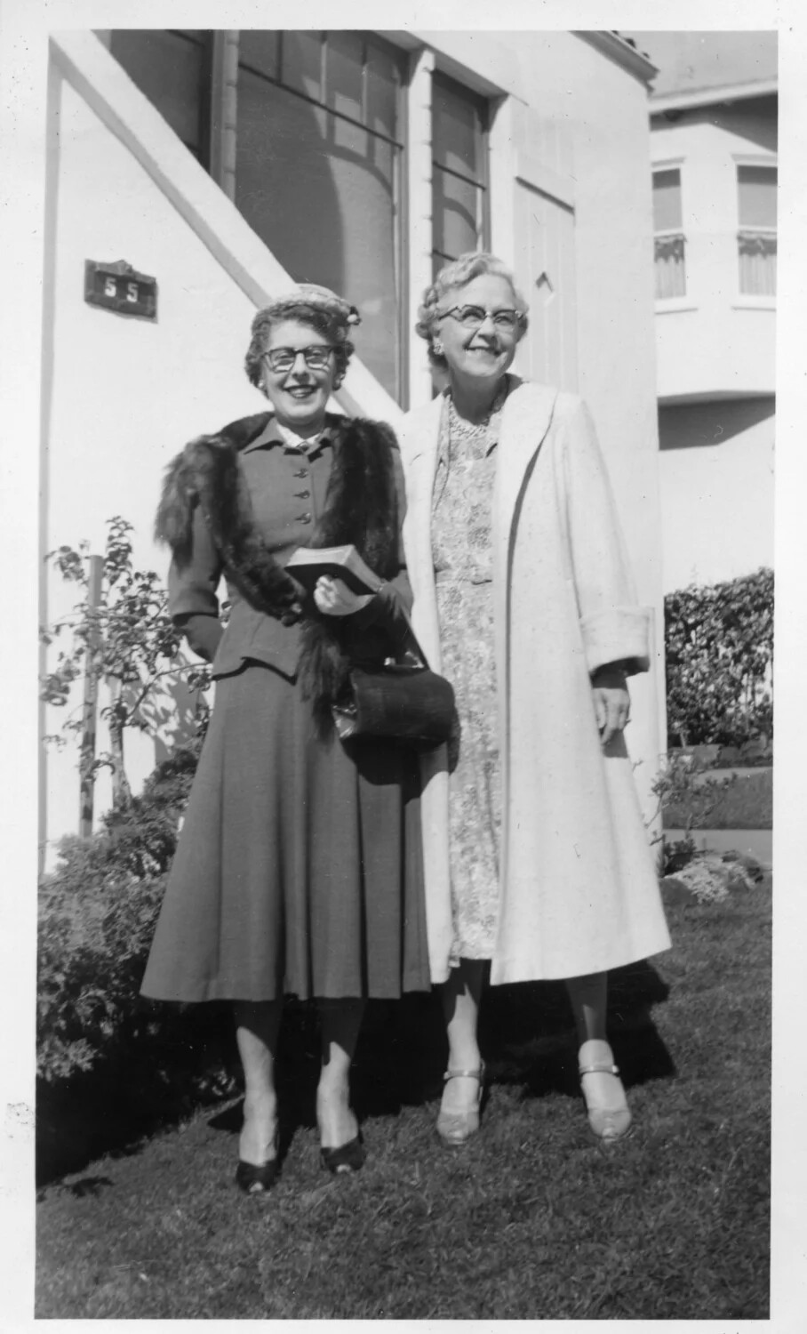 Two Women in Formal Attire Outside House No. 55, Presidio Album, c. 1950s