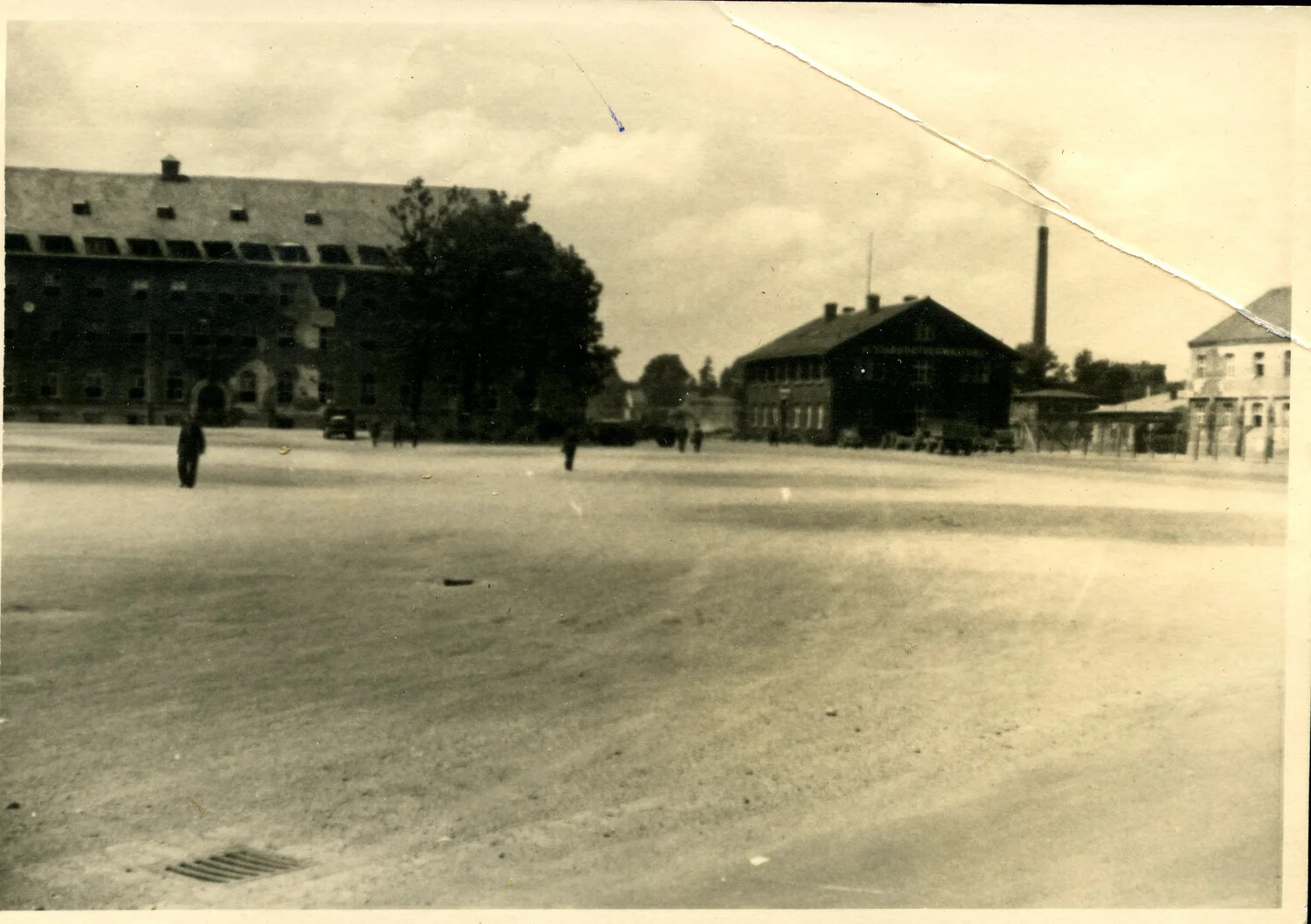 Ground-Level Photograph of a German Military Barracks Courtyard, WWII Occupation Era, 1945