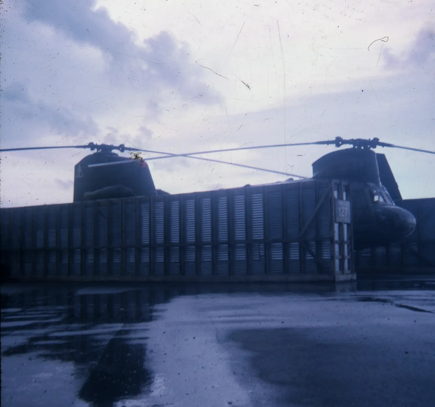 CH-47 Chinook Helicopter on Wet Airfield Ramp, Vietnam War Era