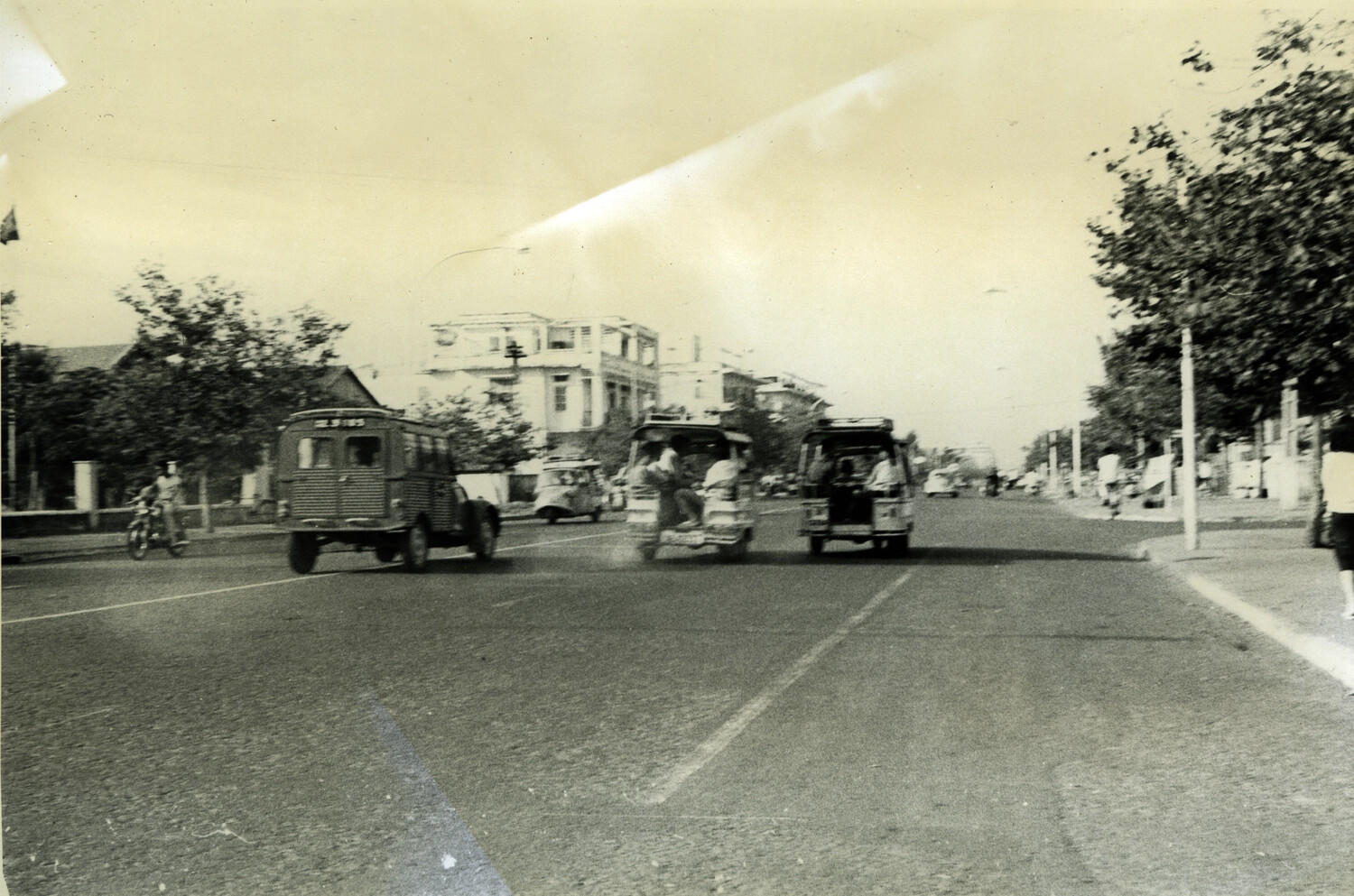 Boulevard Traffic with Van and Taxi-Bus Vehicles, Phnom Penh, Cambodia, c. late 1960s-early 1970s