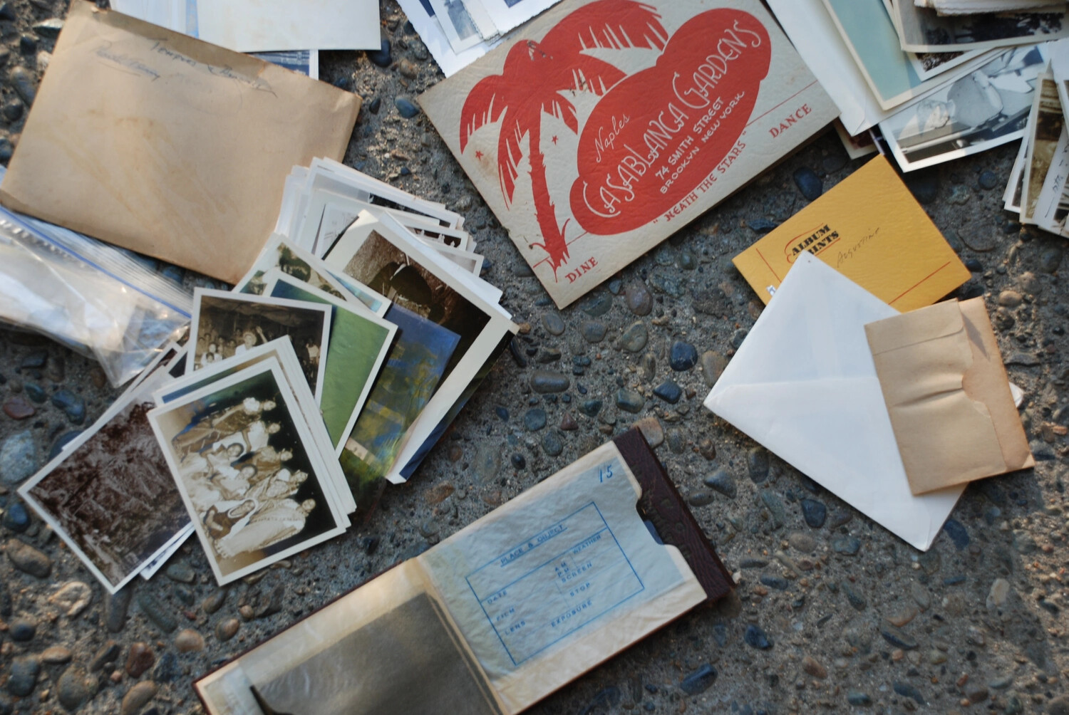 Flat-Lay of Personal Photographs, Ephemera, and Photo Log from the Kotec China-Burma-India Collection