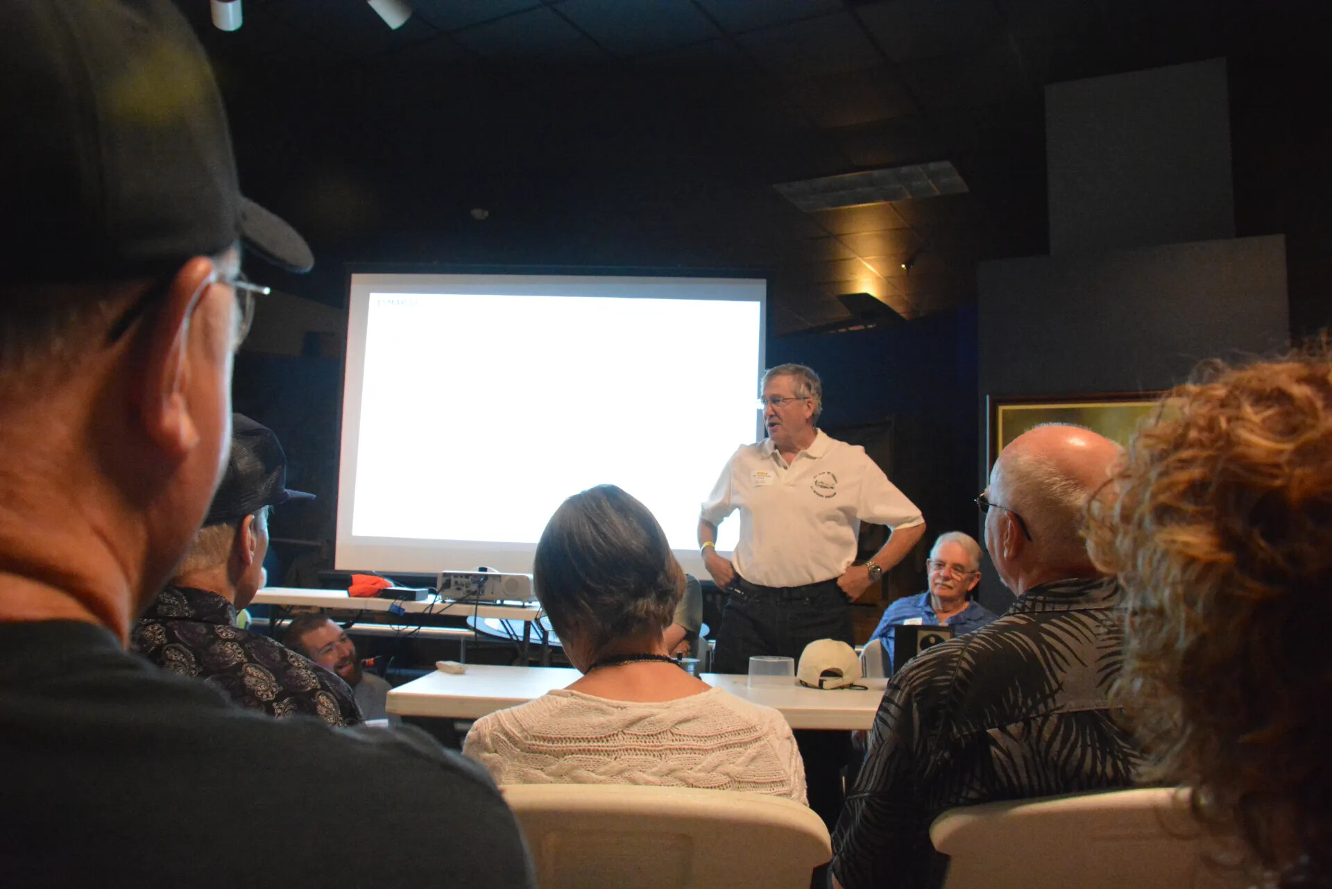 Speaker Addressing Audience Beside Projector Screen, Tennessee Museum of Aviation