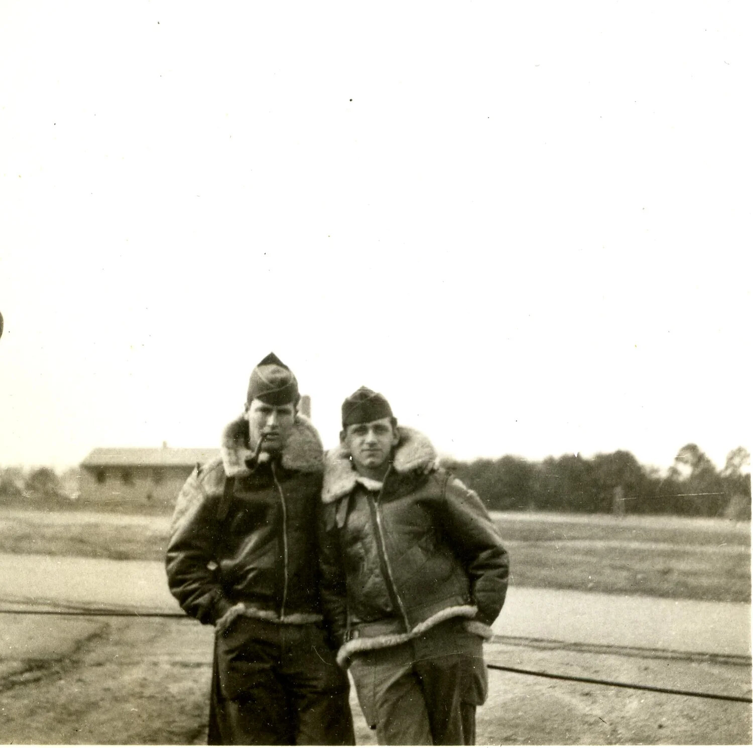 Two Airmen in Flight Jackets Posing Outdoors, Training Base