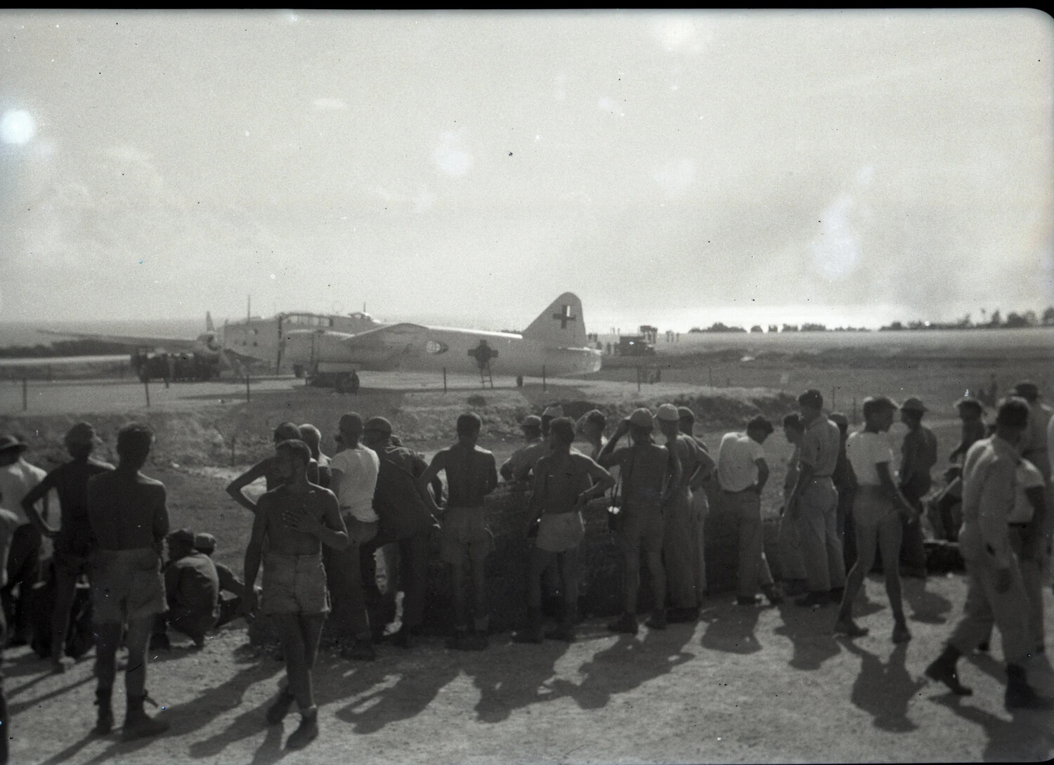 Servicemen of the 345th Bomber Group Observe Cross-Marked Aircraft on the Flight Line, Ie Shima, 1945