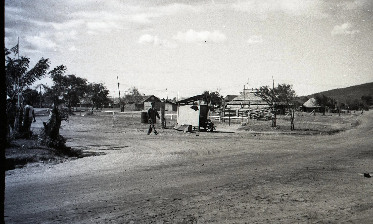 Camp Road with Guard Shack and American Flag, Luzon, Philippines, WWII Era