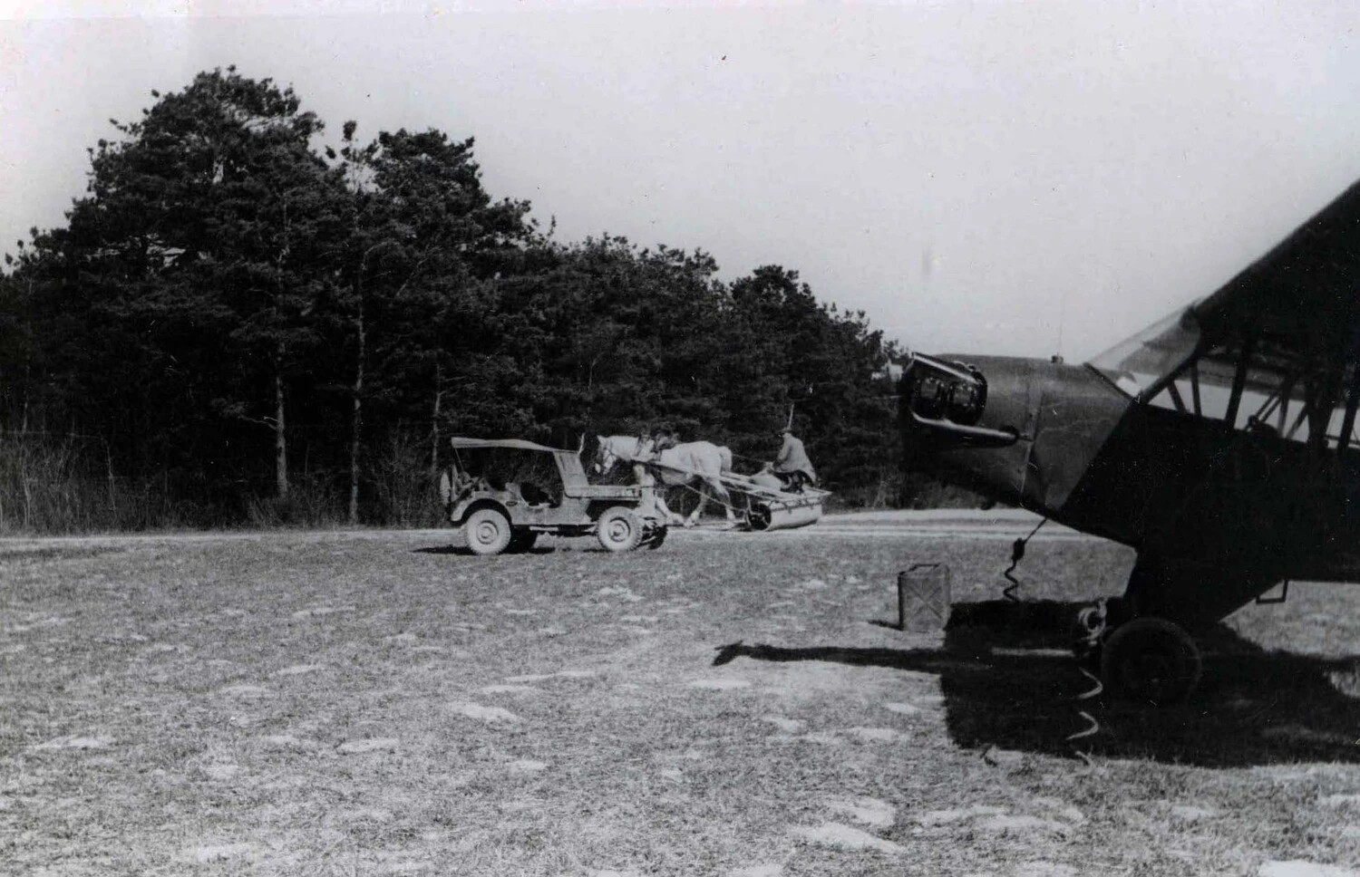 L-4 Grasshopper Aircraft with Jeep and Horse-Drawn Field Roller at Forward Airstrip, WWII