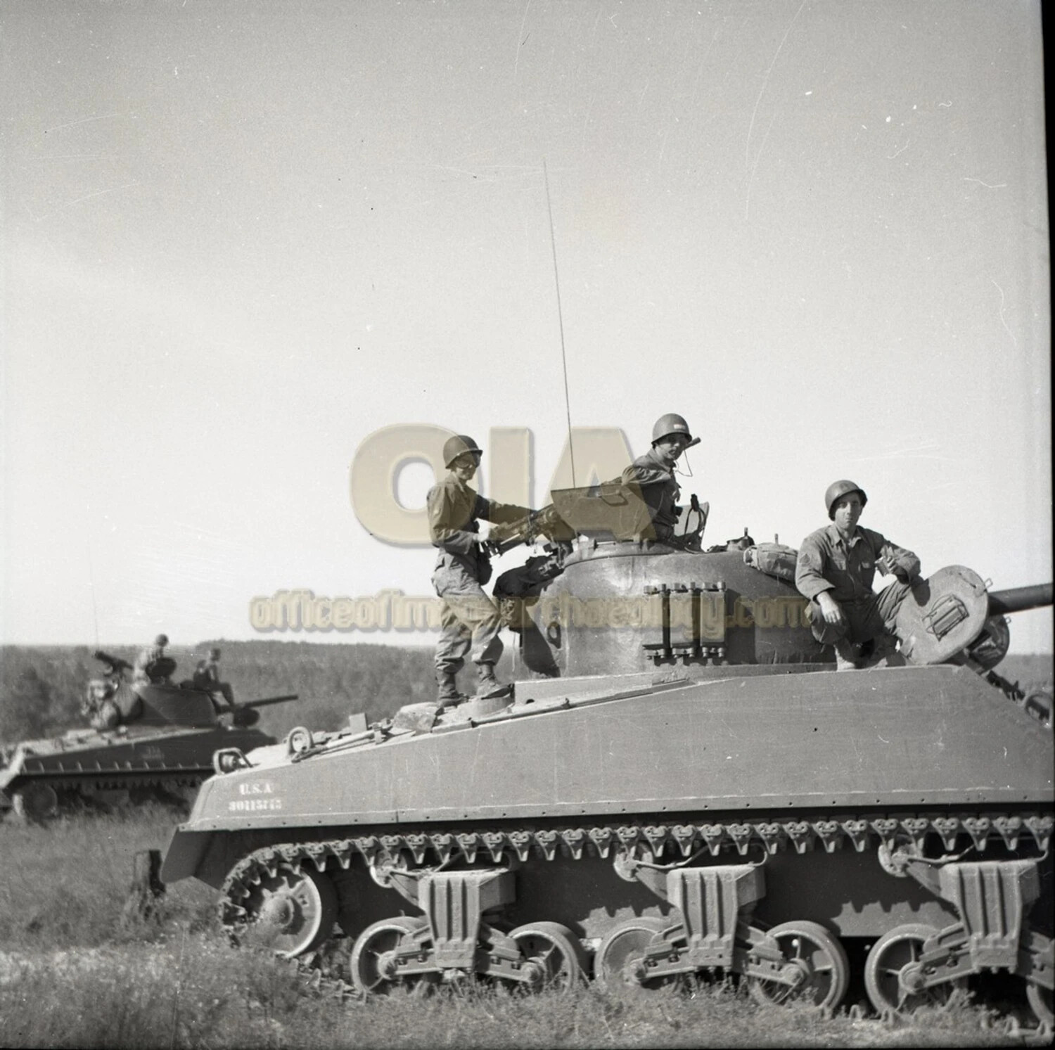 M4 Sherman Tank Crew Handling Small Arms Atop Turret During Training