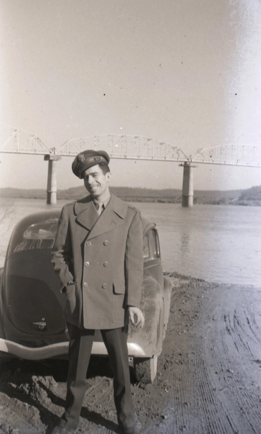 Serviceman in Overcoat Beside Automobile Near River Bridge, Kotec China-Burma Collection