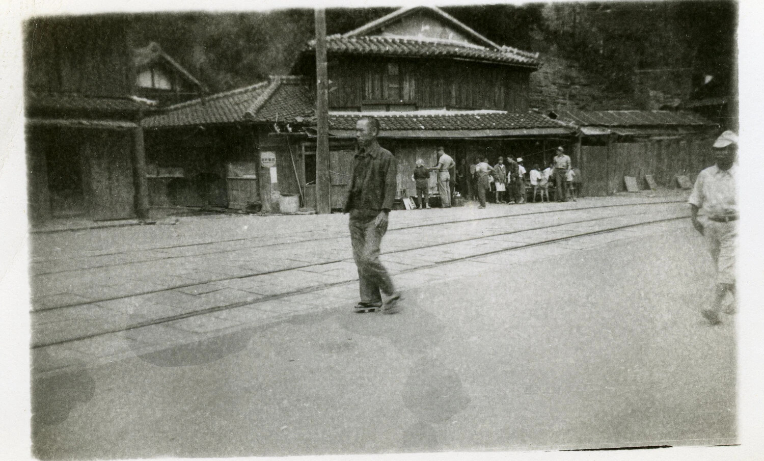 Street Scene with Tram Tracks and Local Shops, Occupied Japan
