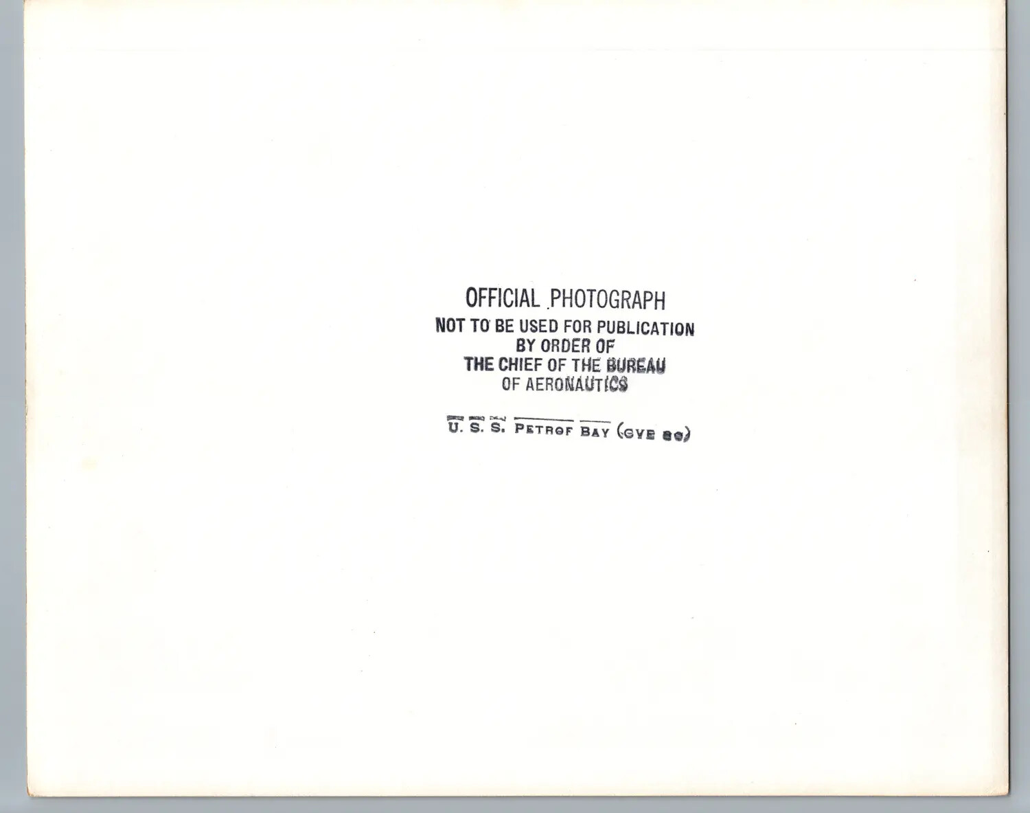 Verso of Official U.S. Navy Photograph Stamped U.S.S. Petrof Bay (CVE-80)