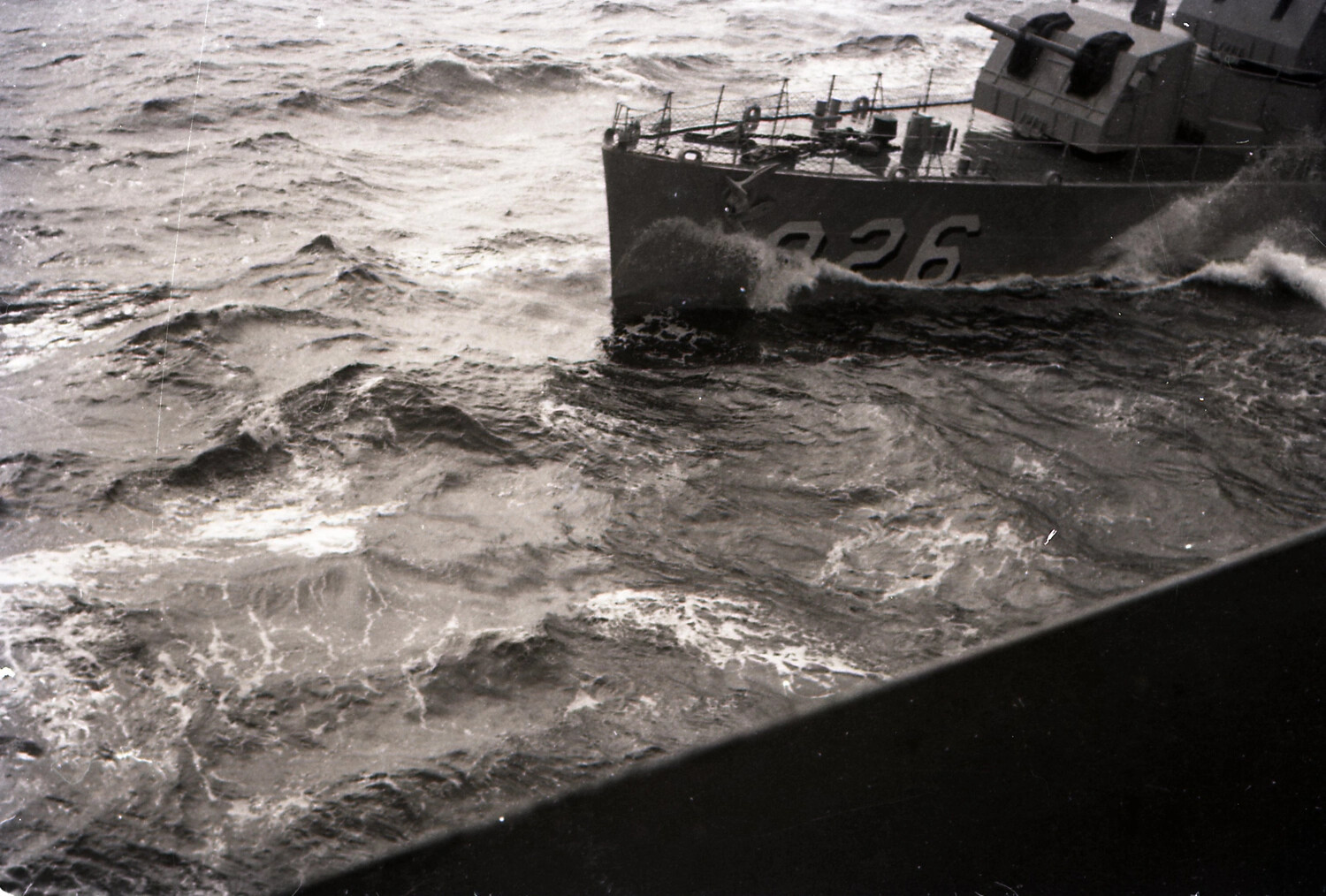 USS Agerholm (DD-826) Underway in Heavy Seas, Photographed from USS Yorktown, 1953