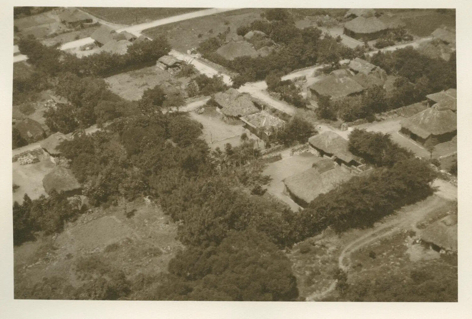 Aerial Reconnaissance Photograph of a Pacific Island Village, USS Petrof Bay Collection