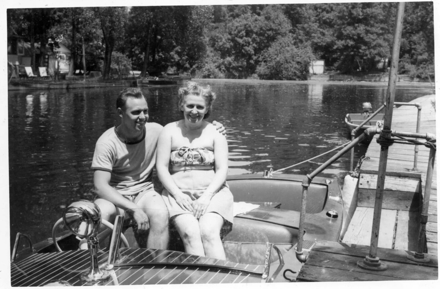 Man and Woman Aboard a Wooden Runabout Motorboat, Lakeside Recreation Photograph