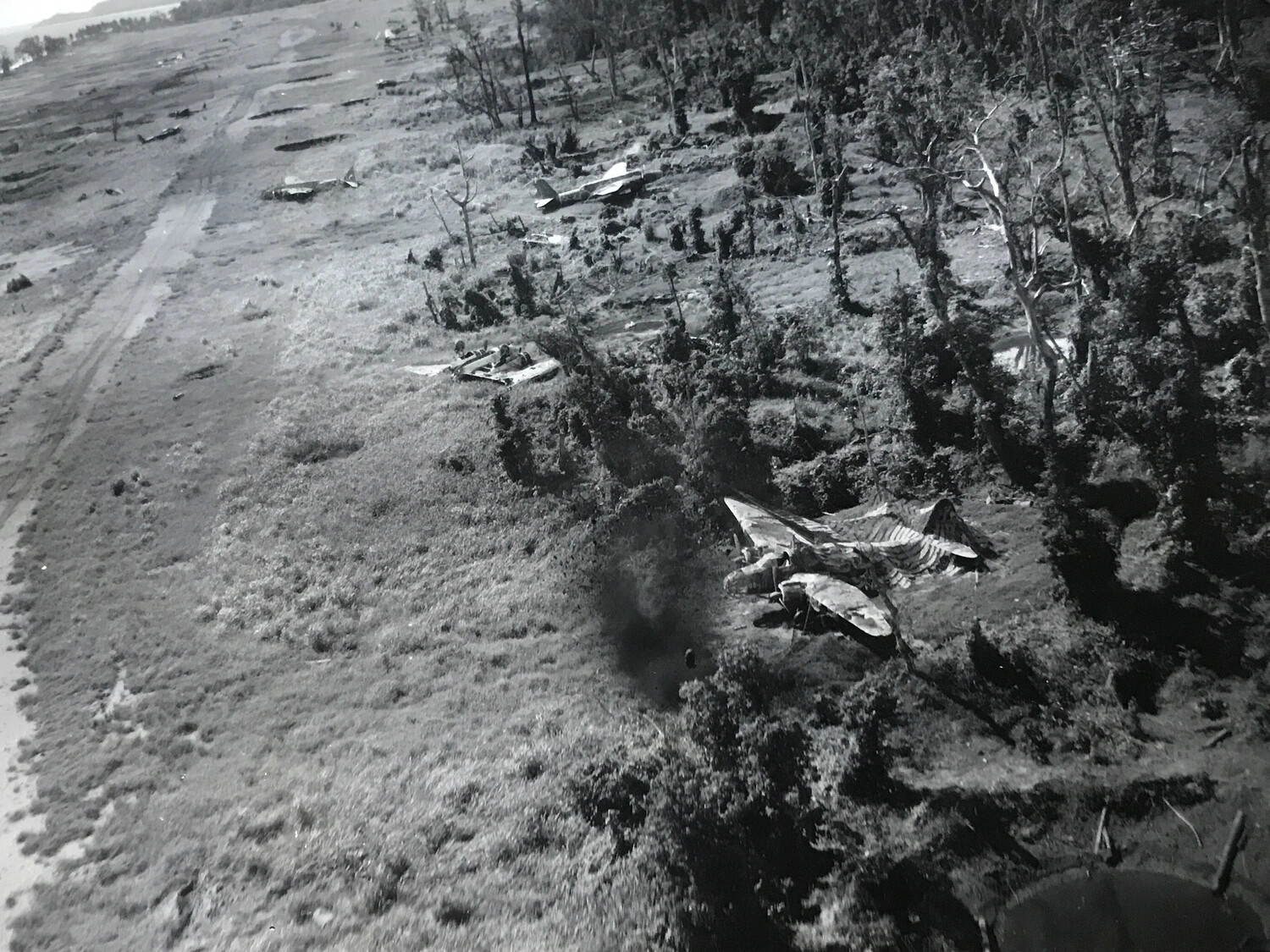 Bomb Impact Near Wrecked Japanese Betty Bomber, Wewak Airfield
