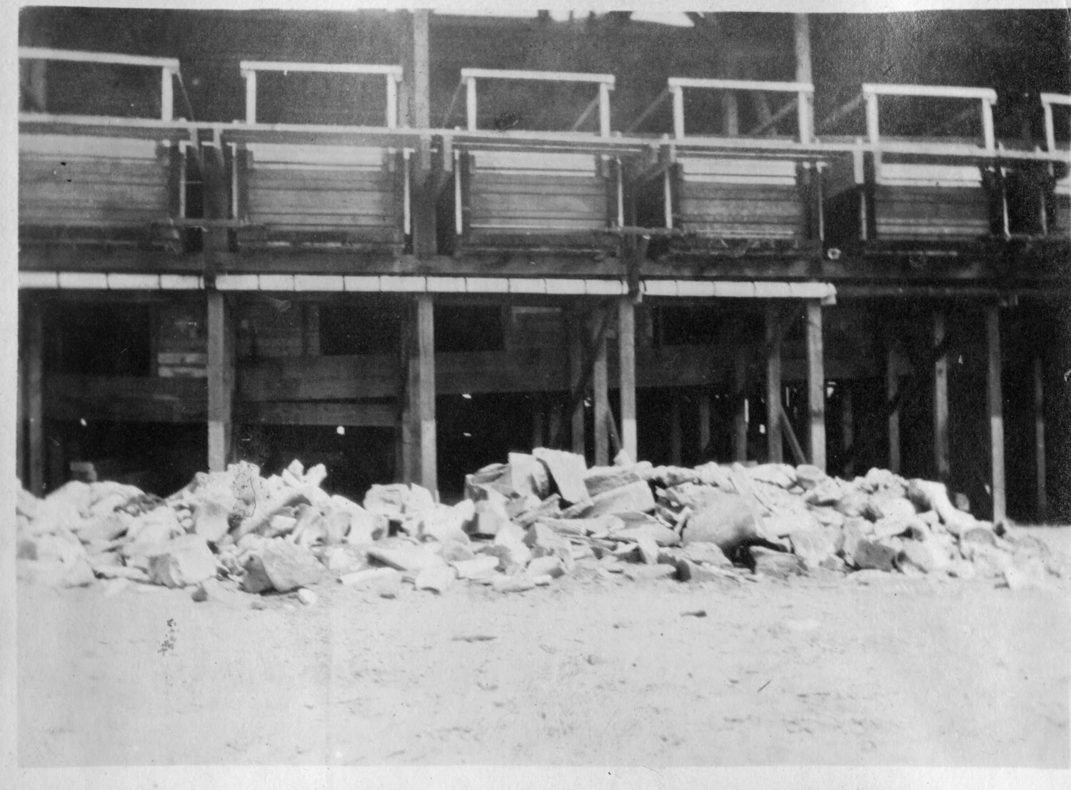Timber-Framed Ore or Rock Bin Structure with Rubble Pile, Industrial/Quarry Site, Early 20th Century