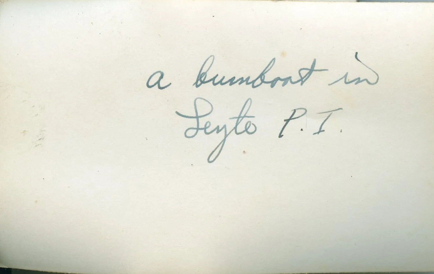 Handwritten Caption Card: "A Bumboat in Leyte, P.I." — WWII Pacific Theater Photo Album Annotation