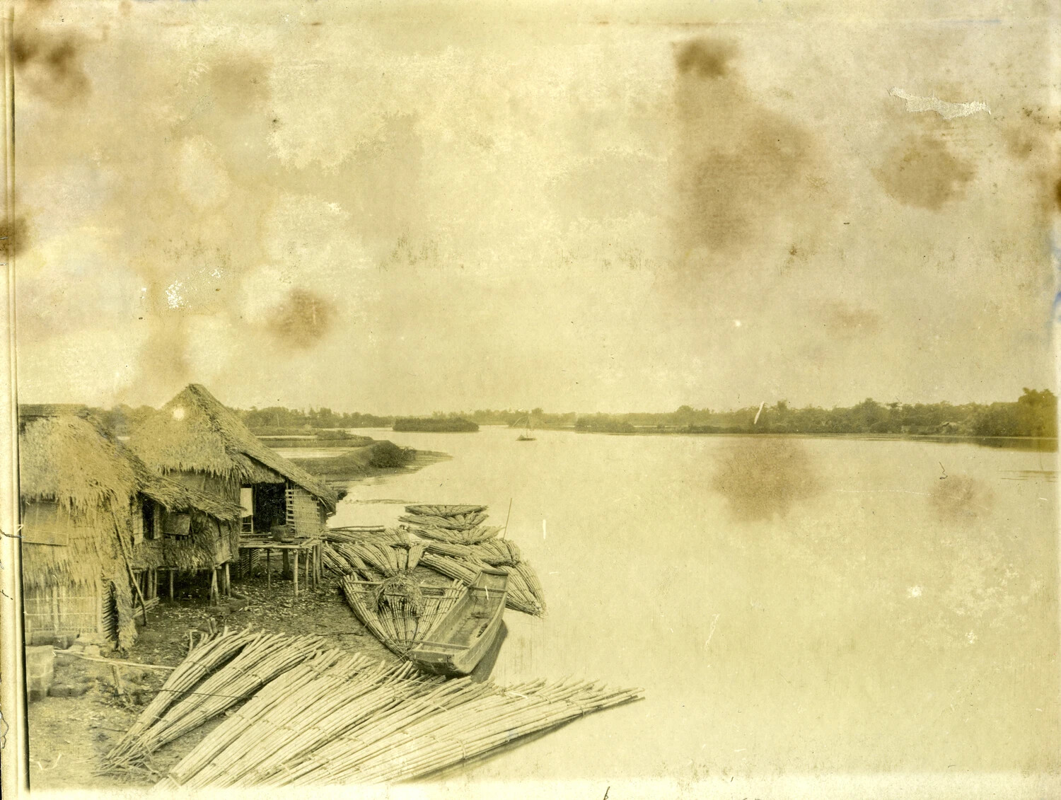 Riverside Village with Nipa Huts and Bamboo Rafts, Philippines, Early 1900s (Stone Album)