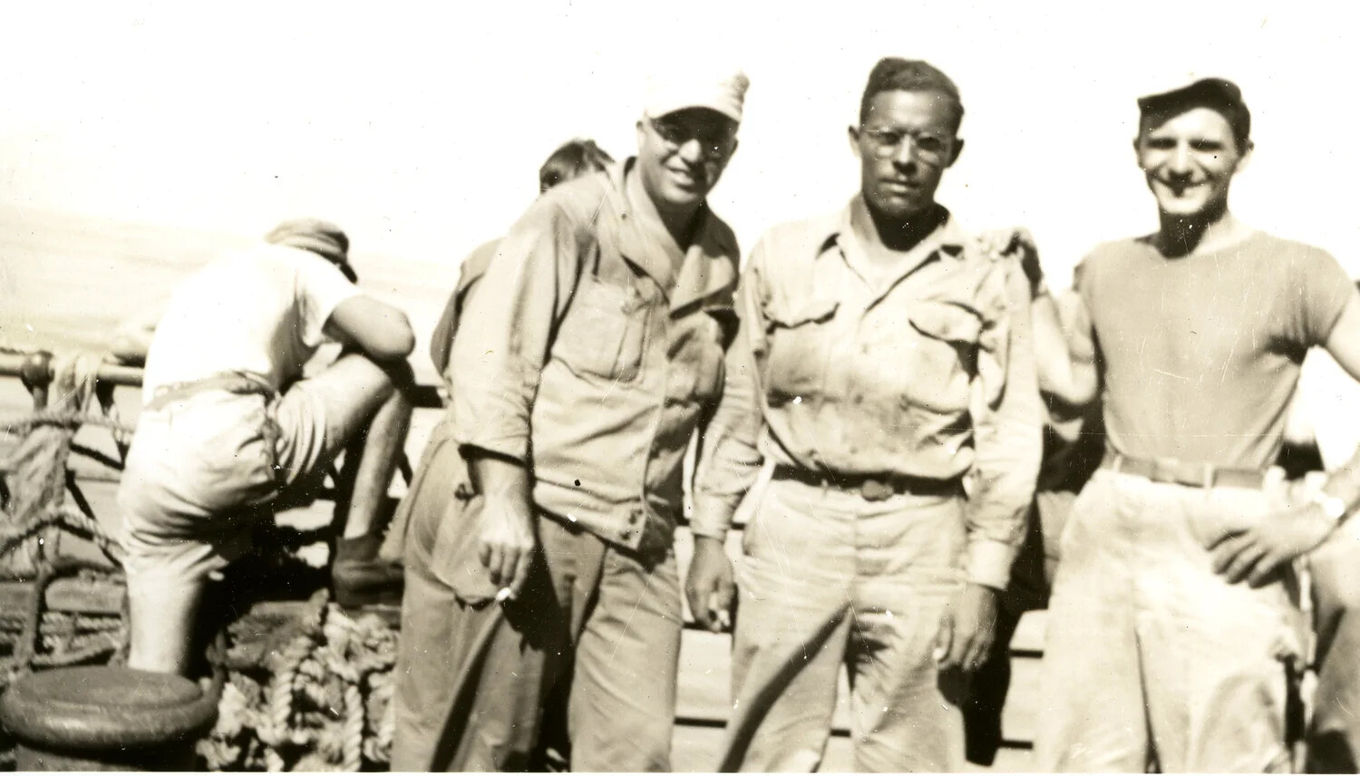 Four Servicemen on Deck of Troop Transport, Pacific Theater