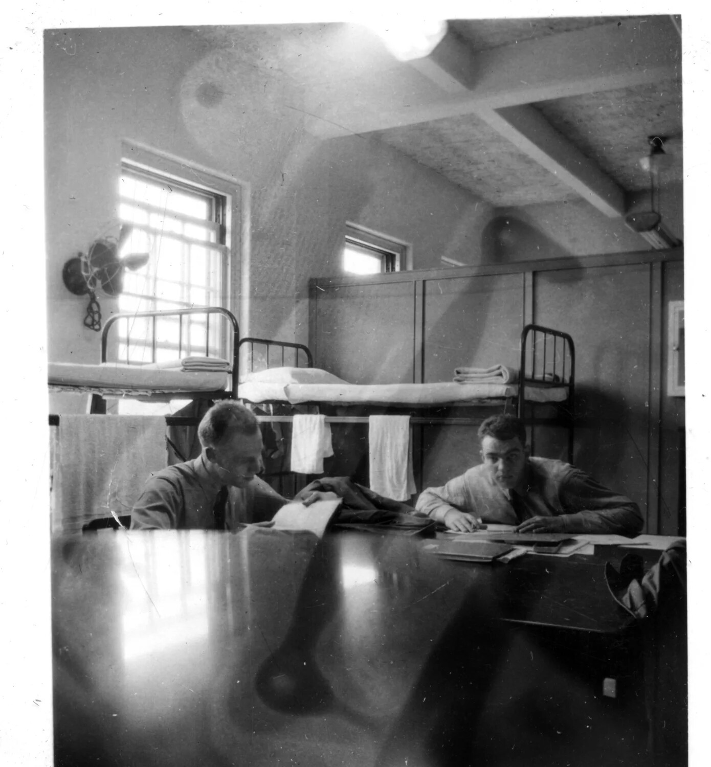 Two Servicemen Reviewing Paperwork in Barracks, Lt. Bancroft Korean War Collection