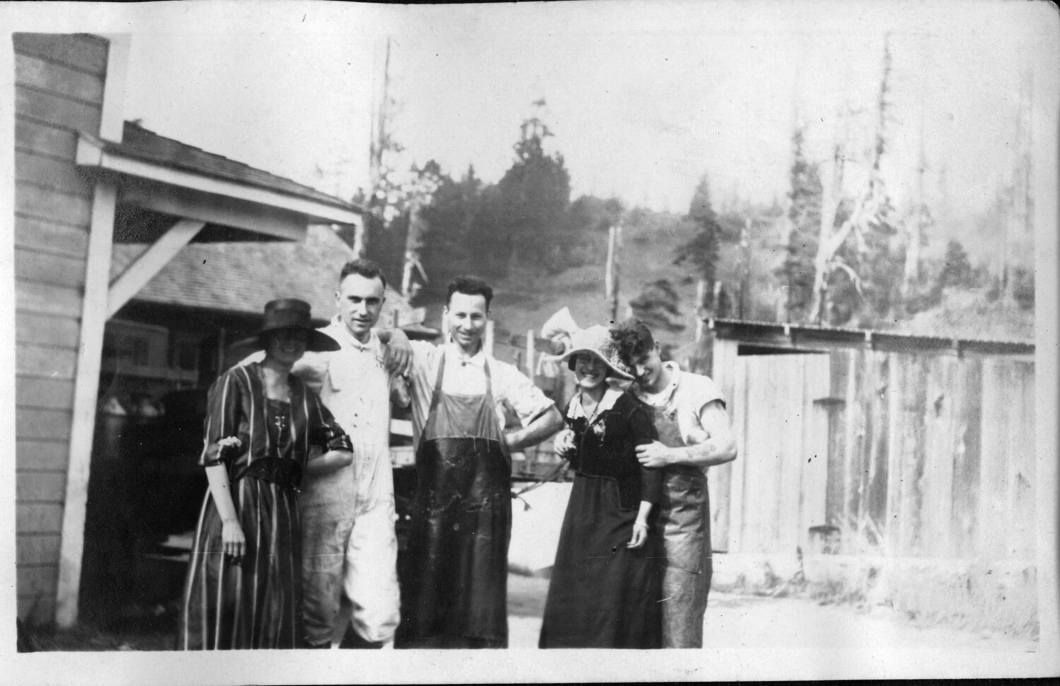 Group Portrait of Five Young Adults at a Workshop or Mill Building, Early 1920s